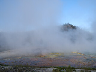 Steam rises from the various holes and geysers within Yellowstone