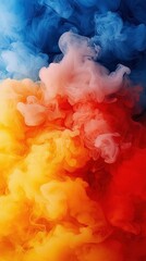 Fototapeta premium A red, yellow, and blue cloud of smoke on a white and black background with a blue sky in the background is a stunning photograph that captures the beauty of nature The use of vibr