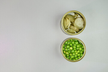 Very colorful canned vegetables, in a zenithal or top shot with a gray background and space for text