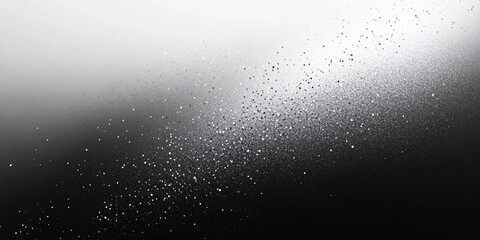 Obraz premium Minimalistic black and white gradient background featuring scattered particles transitioning across the surface
