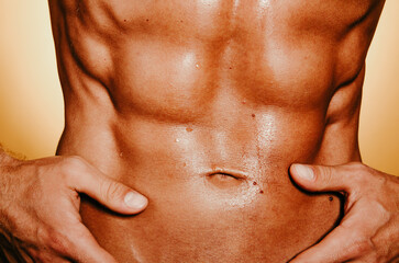 Fototapeta premium Young handsome man with athletic figure. Diet and sport.