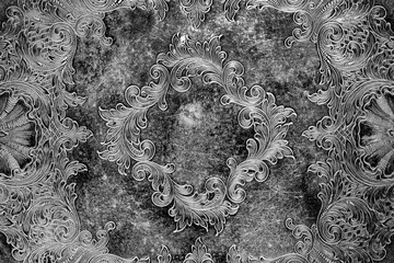 Engraving pattern background on an antique silver plate pewter tray.  Antique vintage metalwork...