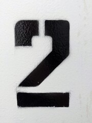 Number 2 painted on the wall with a stencil, New York - June 2022