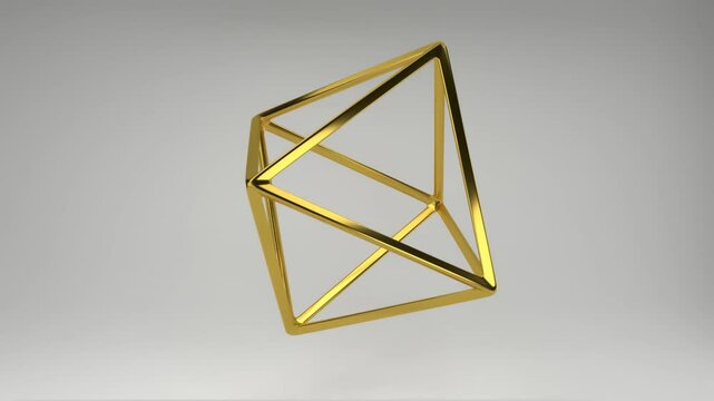 Realistic 3D rendering of a golden octahedron slowly rotating on its axis. Beautiful backdrop with the geometric shape of the Platonic solids. Looped footage.