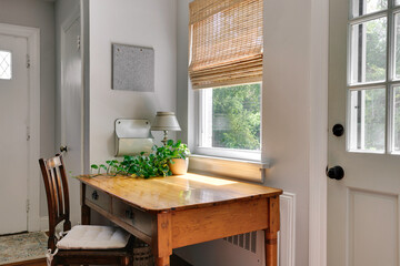 Bright Wooden Desk Space With Natural Light And Greenery View