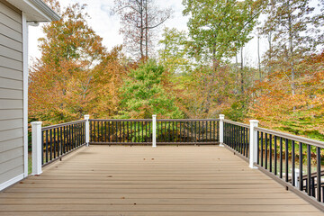 Backyard Deck With Black Railings And Fall Colors