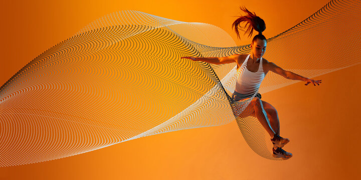 Young athletic woman, runner in motion, jumping, training against orange background with abstract neon wave elements. Concept of sport, action, competition. Creative banner, ad. Modern art