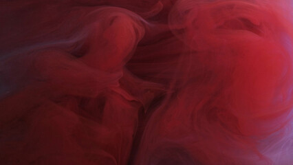 Paint moisture. Air splash. Colored smoking cloud. Vibrant red purple gleaming explosion vapor wave art texture on abstract background.