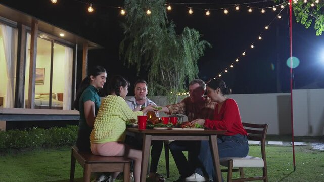 Family gather celebrate holiday. Parents, grandparents and girl together to talk and have dinner party food. Outdoor activity for spending time with cute relatives cross generation gap. Divergence.