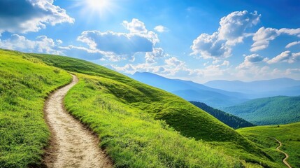 Obraz premium Curving unpaved path meanders through lush green hills beneath a bright blue sky adorned with fluffy clouds