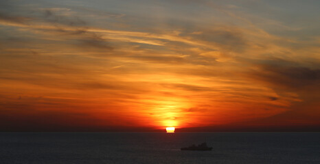 Fototapeta premium Photos of an unusual autumn sunset at sea