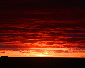 Photos of an unusual autumn sunset at sea