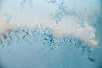Winter background, natural frost pattern on window