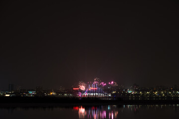 Colorful fireworks celebration and the city night light .
