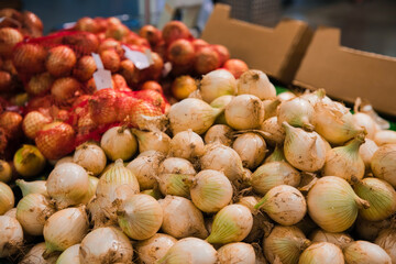 Yellow onions on market stall