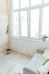 Interior of an empty white room with a window