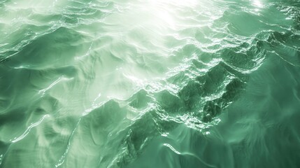 Obraz premium Trendy mint green abstract background featuring caustic light and shadow effects created by light passing through glass resembling a watery landscape