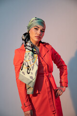 Portrait of a beautiful fashionable woman in a red autumn dress