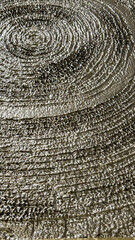 Fototapeta premium Silver textured spiral pattern on a reflective surface, suitable for modern art backgrounds, abstract designs, and decorative uses in commercial and residential spaces