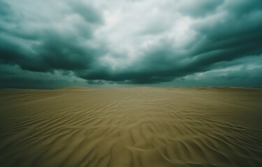 Fototapeta premium Photograph of an Endless Desert with Sand Ripples and a Dramatic Cloudy Sky