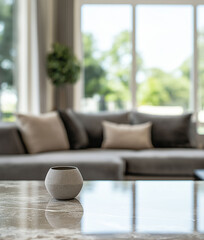 Empty space on a marble table with a comfortable sofa in a blurred modern comfortable living room