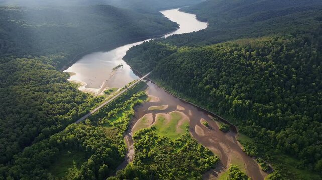 Aerial footage of the NY-17 road crossing Allegheny River on a sunny day in Pennsylvania, USA