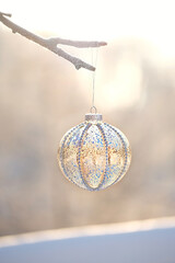 Christmas background. beautiful Christmas glass ball on tree branch, abstract nature background. symbol of Christmas and new year holidays, winter festive season. soft focus