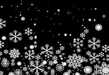 White snowflakes on a black background winter