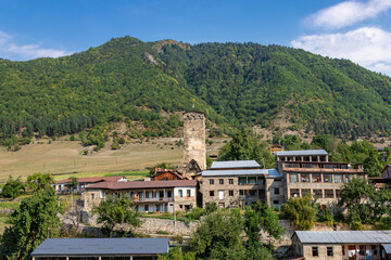 Mestia town in Georgia. The medieval Svan Towers is a traditional fortified residence in Mestia, Georgia. Svan towers and structures surrounded by green colors.