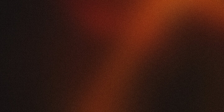 Orange light blending into a black background, creating a textured gradient perfect for backgrounds and overlays