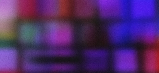 Naklejka premium Blurred background of colored textures on a black background with a grainy texture