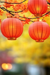 Obraz premium Red lanterns hanging amidst vibrant autumn leaves create a warm, festive atmosphere, AI