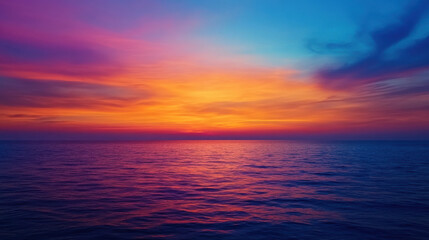 Fototapeta premium Vibrant sunset over calm ocean waters with colorful sky reflections