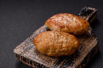 Delicious fresh fried minced fish cutlets with spices and herbs