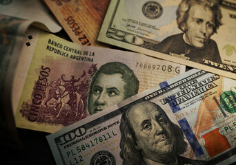 Assorted American dollars and Argentina pesos