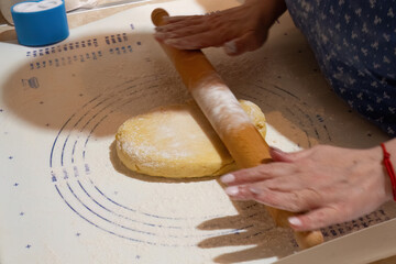 Rolling dough on a floured surface
