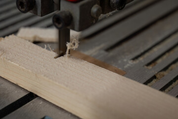 Band Saw Cutting Through Wooden Plank
