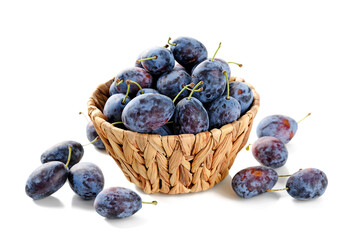 Basket of fresh ripe plums isolated on white background