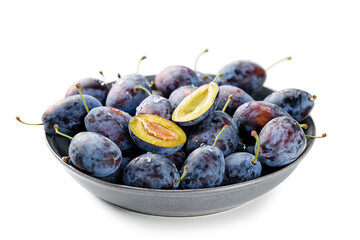Plate of fresh ripe plums isolated on white background