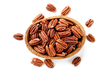 Pecan nuts in wooden bowl isolated on white background. top view