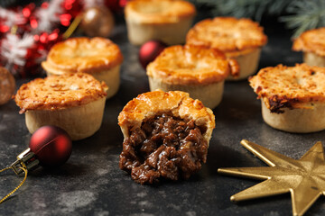 Christmas steak mini pie with decoration, gifts, green tree branch