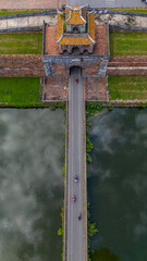 Aerial view of The Imperial City of Hue, Vietnam. It was designated as a UNESCO World Heritage Site in 1993. The grounds are protected by fortified ramparts and ringed by a moat. Vietnamese flag flies