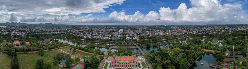 Aerial view of The Imperial City of Hue, Vietnam. It was designated as a UNESCO World Heritage Site in 1993. The grounds are protected by fortified ramparts and ringed by a moat. Vietnamese flag flies