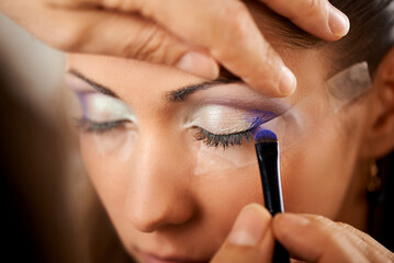 Professional Makeup Artist Applying Eye shadow