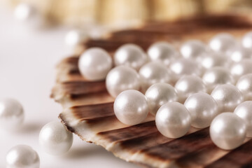 The beauty of white pearls in the shell, is an amazing combination of nature and elegance in every luster and shape