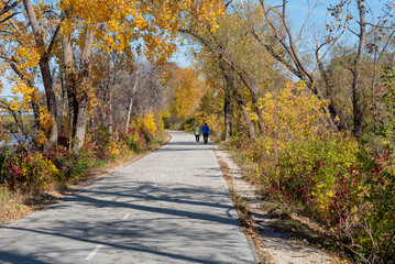 Couple Walking On The Fox River Trail Near De Pere, Wisconsin, In Fall