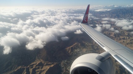 View from the plane: Clouds above the mountains, clouds and sky, clouds in the foreground, clouds...