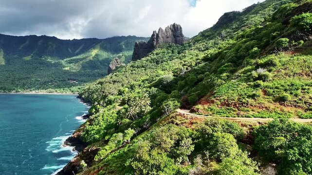 Drone Marquesas Islands. Aerial view Nuku Hiva island in French Polynesia. Tropical beach, palm trees and clear ocean water. Exotic travel vacation getaway, romantic paradise tourism destination. 