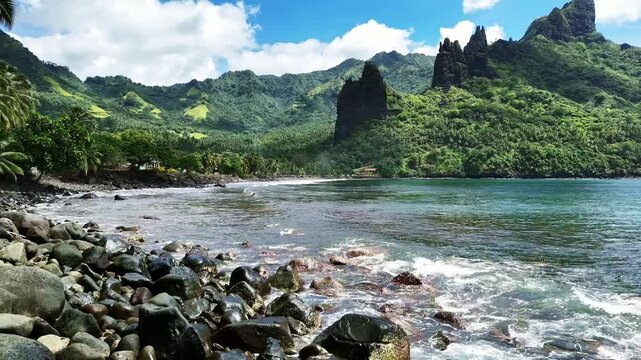 Drone Marquesas Islands. Aerial view Nuku Hiva island in French Polynesia. Tropical beach, palm trees and clear ocean water. Exotic travel vacation getaway, romantic paradise tourism destination. 
