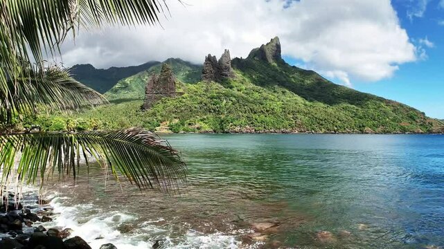 Drone Marquesas Islands. Aerial view Nuku Hiva island in French Polynesia. Tropical beach, palm trees and clear ocean water. Exotic travel vacation getaway, romantic paradise tourism destination. 